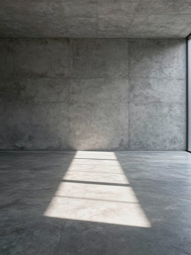 Minimalist concrete interior, a single shaft of direct sunlight cutting across a polished plaster floor, empty space, portrait orientation.