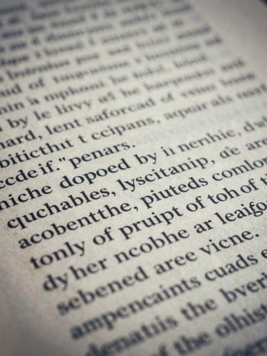 Macro photograph of printed academic journal pages, sharp focus on black typography over cream paper, cool diffused daylight, deep slate tones, editorial academic photography style