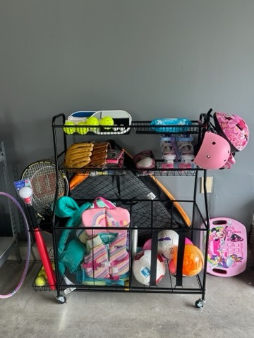 an organized sports equipment rack