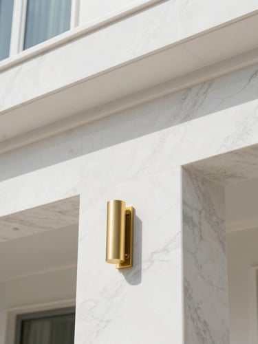 Close-up of clean architectural details, brushed gold fixtures against white marble in a modern Doha villa, sharp focus, natural light