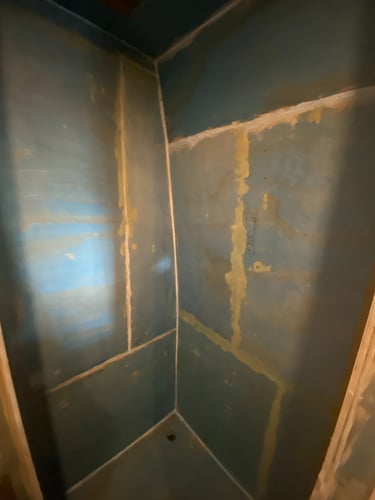 shower coverd with blue primer