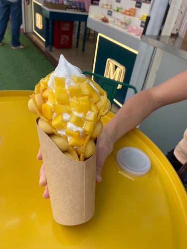 bubble waffle in shnaghai filled with mango and ice cream