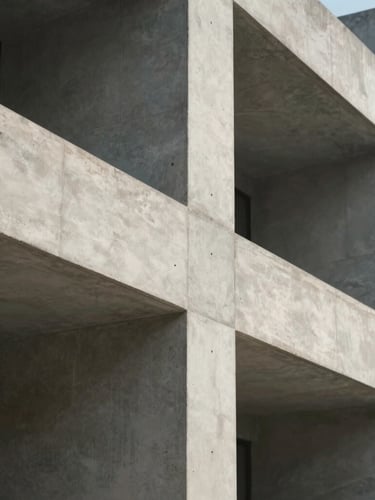Abstract architectural close-up of clean concrete lines and soft shadows, minimalist stone texture, elegant natural light, cinematic 35mm