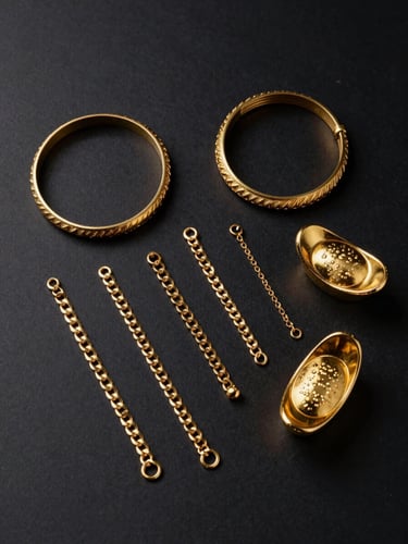 Overhead flat-lay of gold jewellery pieces — bangles, chains, and a small ingot — arranged on a matte black surface under institutional strobe lighting, sharp metallic highlights on each surface, cool-toned professional light, no people, no background clutter