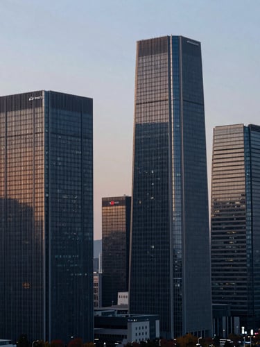 Modern Seoul skyline at dawn, crisp light, focused on architectural details, with a subtle hint of a business district in the background. Editorial corporate photography, cool morning daylight, deep navy and gold tones, sharp focus, architectural and professional.