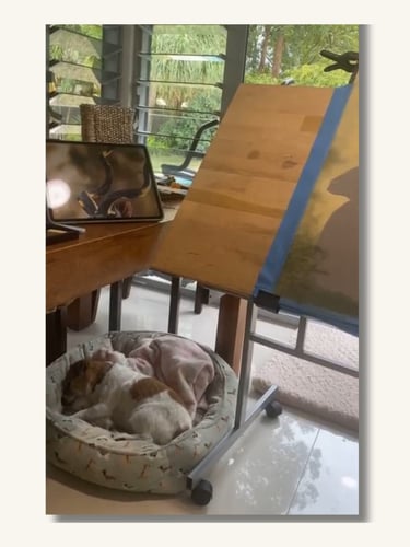 Artist easel and workspace where custom pet portraits are created by hand.