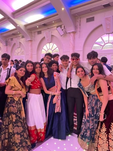 a group of people standing around a dance floor