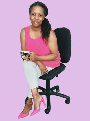 a Doula sitting on a chair with a cup of coffee
