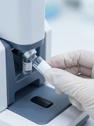 Macro close-up of a gloved hand inserting a specimen vial into an automated analyzer, sterile cool white lighting, sharp focus, 35mm