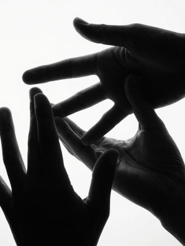 Stark high-contrast black and white close-up of hands in a precise, structured gesture against a pure white background, hard directional lighting, deep black shadows, architectural lines, 35mm.