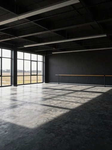 Wide environmental shot of an empty, well-lit modern training room in Saskatchewan with high-contrast shadows, industrial minimalism, overcast natural light.