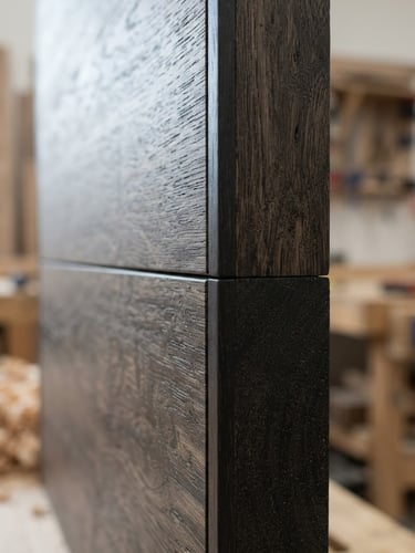 Extreme macro close-up of perfectly flush edge-banding on a dark oak veneer panel, diffused architectural workshop lighting, sharp focus, 50mm lens