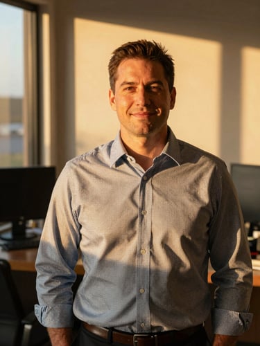 A warm golden-hour portrait of a Texas insurance agent in a natural, sunlit office setting, looking friendly and professional, 35mm lens