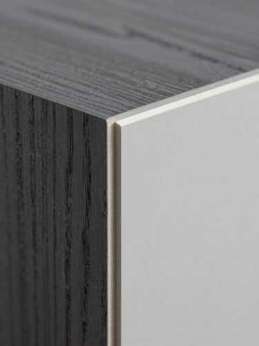 Macro close-up of a clean melamine panel edge-banding, high-contrast side-lighting highlighting the precise bond line, raw wood grain, 50mm
