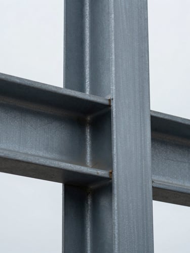 Extreme macro close-up of structural steel joint showing material stress texture, sharp focus, cool metallic tones, overcast daylight, 35mm lens
