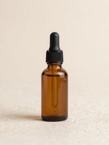 Macro shot of minimalist amber glass dropper bottles on a warm stone surface, soft clinical light, clean shadows