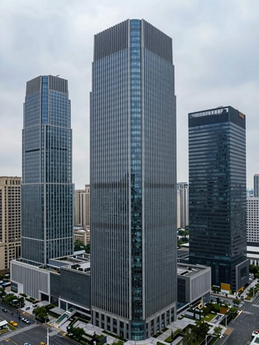 High-angle architectural photograph of modern commercial skyscrapers in a major financial district under cool overcast daylight, sharp structural lines, wide environmental composition.