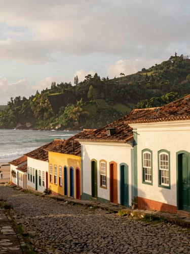Wide shot of historic colonial buildings with colorful facades in São Francisco do Sul, cobblestone street, soft overcast coastal light, editorial travel style.
