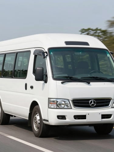 A clean white passenger microbus driving on a well-lit highway in Colombia during bright daylight, sharp focus, professional corporate photography.