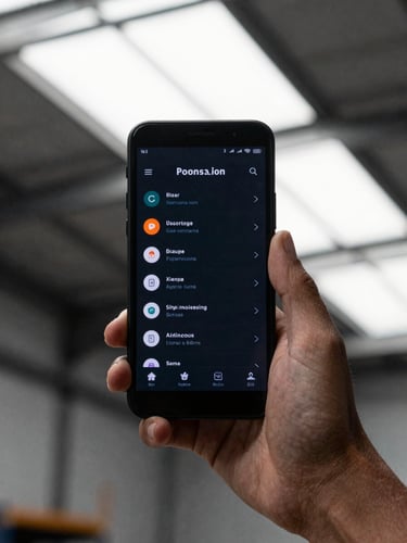 Over-the-shoulder shot of a rugged handheld Android device displaying a high-contrast dark-mode UI, natural overcast daylight filtering through a warehouse skylight, shallow depth of field, 35mm