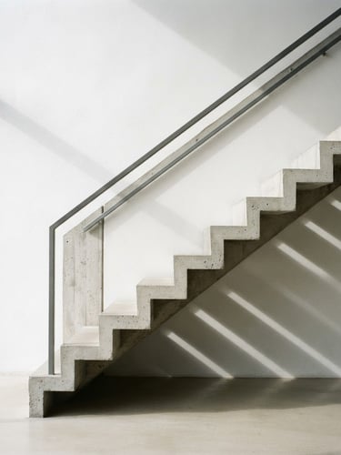 Architectural detail of a minimalist concrete staircase casting sharp geometric shadows under diffused daylight, 35mm photography