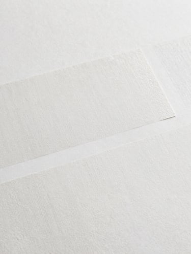 Extreme close-up flat-lay detail of a photocomposite artwork by Clare Newton, showing textured layers, subtle digital brushwork, and physical interventions, soft diffused gallery lighting, high-resolution archival detail, 35mm