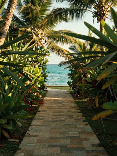 A quiet, sun-dappled stone path leading through lush tropical foliage toward a glimpse of the turquoise sea, golden-hour light, medium format film look.
