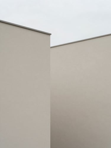 Minimalist editorial photography of clean architectural lines, soft overcast daylight, muted slate tones, geometric composition.