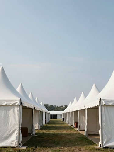 Symmetrical, architectural view of pristine white event tents pitched in perfect alignment under crisp daylight, showcasing structural integrity.