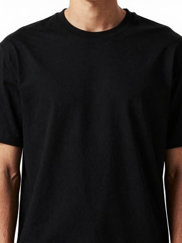 Portrait shot of a model wearing a heavy black drop-shoulder t-shirt, showing the thick fabric drape and rich texture, high-contrast studio lighting, deep shadows, 85mm lens