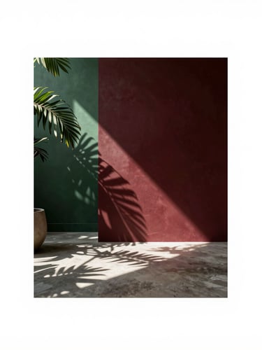 Elegant editorial photography of a modern, sunlit creative studio in Brazil, shadows of tropical leaves dancing on concrete floors, warm natural light, 35mm