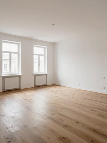 Wide shot of a fully renovated Turin apartment living room, empty and ready for handover — freshly painted white walls, new SPC flooring, clean electrical fixtures, daylight from tall windows, no people, documentary framing