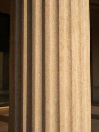 Extreme close-up of a minimalist travertine marble column in Dubai, warm golden-hour architectural daylight, rich desaturated tones, 35mm