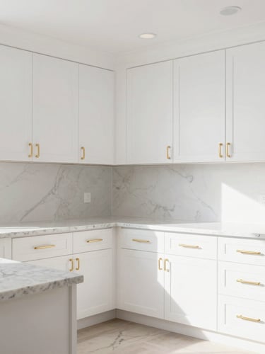 Bright newly remodeled kitchen with clean white cabinets, quartz countertops, natural daylight, warm gold hardware, straight-on architectural angle