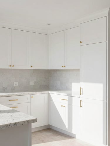 Bright modern kitchen remodel with crisp white cabinets, warm gold hardware, clean quartz countertops, natural daylight, straight architectural angle.