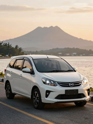 A clean Perodua Ativa parked on a coastal road in Kota Kinabalu, warm golden hour light reflecting off the windshield, Mount Kinabalu faint in the background.