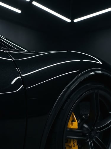Extreme close-up of a flawless black luxury sports car fender under sharp LED studio light bars, metallic obsidian paint reflecting perfectly straight lines, 50mm lens