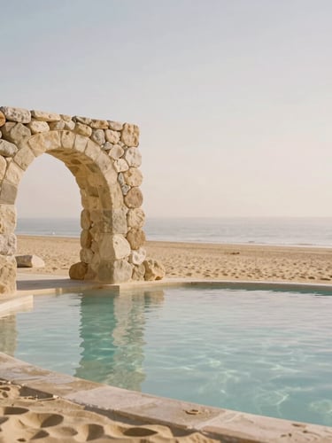 Minimalist side view of a sun-drenched stone archway overlooking a calm, clear thermal pool, warm sand tones, soft morning daylight, editorial photography.