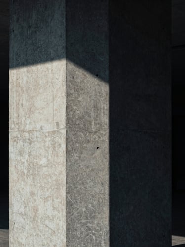 Tight geometric crop of a concrete architectural column casting sharp shadows, low-key dramatic lighting, cool tones.