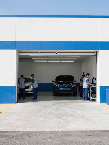 Wide environmental shot of a clean, bright, and organized Orem garage bay with professional technicians in clean uniforms working, crisp daylight, 35mm