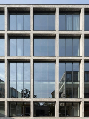 Straight-on architectural photograph of a modern glass and concrete building facade, clean lines, bright morning daylight, cool slate tones, sharp focus, 35mm