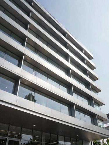 Architectural detail of premium aluminum lambrines on a modern lobby wall, sharp geometric shadows, crisp daylight, wide-angle lens.