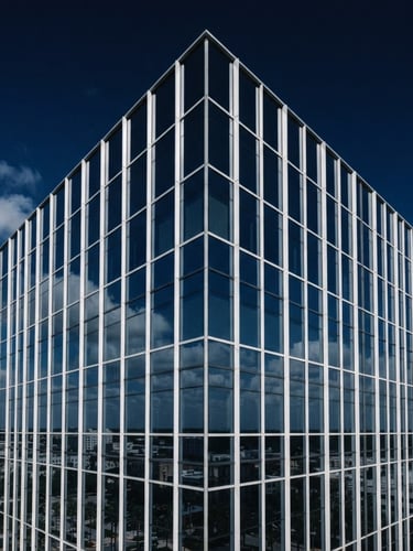 A sharp architectural crop of a modern corporate skyscraper corner in Orlando, bright natural daylight, clean glass reflections, deep navy sky, 35mm