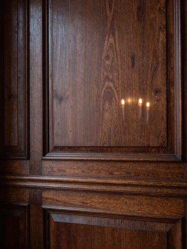 Chiaroscuro architectural detail of a private Parisian salon, soft candlelight reflecting on dark wood paneling, elegant negative space, portrait orientation