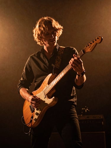 Dynamic low-angle performance shot of Roger Blount playing an electric guitar on a dark stage, warm amber backlighting, high-contrast shadows, 35mm film grain.