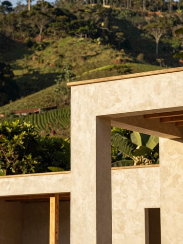Architectural detail of natural building materials being crafted on a hillside construction site in Pereira, warm golden-hour sunlight, lush green background