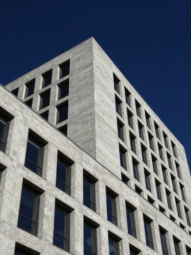 Low-angle brutalist corporate architectural shot, sharp concrete lines against a deep navy sky, high-contrast daylight, 35mm editorial corporate photography.