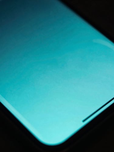 Extreme macro photography of a modern Android smartphone screen showing a fluid UI transition, moody cyber-cyan neon backlighting, high contrast, shallow depth of field
