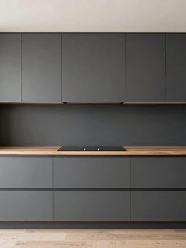 Symmetrical straight-on architectural photograph of a minimalist handle-less kitchen, matte charcoal cabinetry, warm oak accents, soft diffused daylight, 35mm