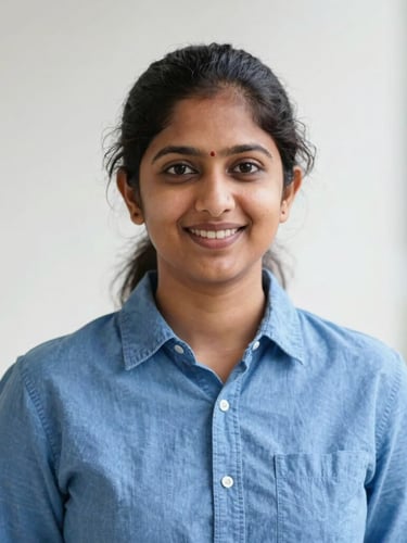 Professional friendly headshot of Gowshika, clean tech photography, bright neutral daylight, crisp blue and white tones, shallow depth of field, 50mm